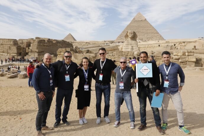 White Sky Travel team with tourists at the Giza Pyramids, Egypt.